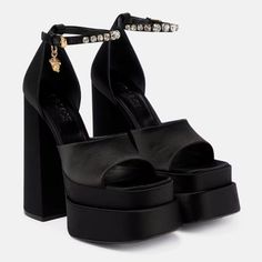 Versace Women's Medusa Aevitas Black Satin Crystal-Embellished Platform Sandals Size 38 It / 8 Us Msrp $1,475.00 Versace's Bold Sandals Are Anchored By A Towering Platformed Block Heel. Crafted Of Soft Satin In Italy, This Statement Pair Features A Dainty Ankle Strap Adorned With Lustrous Crystals And A Medusa Head Charm. Satin Upper Square Open Toe Adjustable Ankle Strap Leather Lining Leather Sole Made In Italy Single Dust Bag Satin-Covered Block Heel, 6" (155mm) Authenticity Guaranteed All Pr Versace Double Platform, Versace Platform Heels Grey, Farfetch Platform Heels, Versace Medusa Platform, Versace Heels, Dr Shoes, Medusa Head, Chunky Shoes, Satin Bags