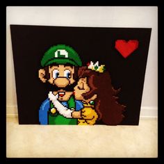 an image of mario and luigi kissing each other on a piece of art that is made out of legos