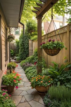 an outdoor patio with hanging planters filled with flowers