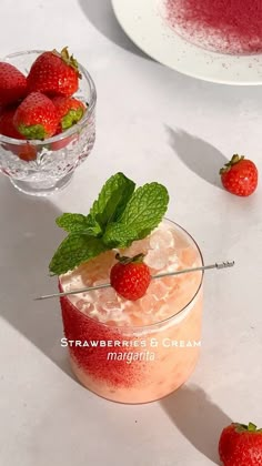 strawberries and cream drink with mint garnish on white table