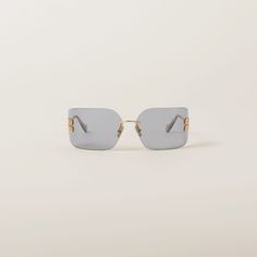 Light Gray Lenses Runway Sunglasses | Miu Miu Modern Miu Miu Sunglasses, Modern Miu Miu Sunglasses With Glass Lenses, Rimless Shield Sunglasses With Mirrored Lenses, Modern Miu Miu Sunglasses With Glass Material, Rimless Glass Shield Sunglasses With Uva Protection, Miu Miu Sunglasses With Mirrored Lenses, Miu Miu Square Frame Sunglasses With Gradient Lenses, Miu Miu Sunglasses With Tinted Glass Lenses, Rimless Glass Shield Sunglasses With Tinted Lenses