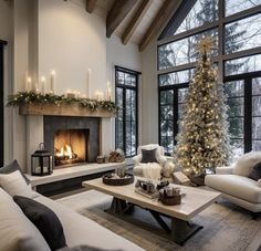 a living room filled with furniture and a christmas tree in front of a fire place