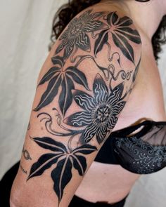 a woman with a tattoo on her arm