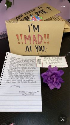 there is a note that says i'm mad at you next to a flower