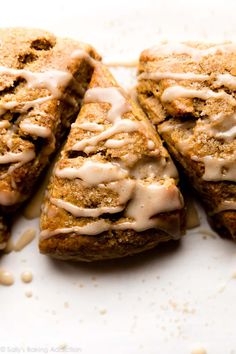 four pieces of food with icing on them