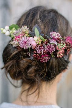 a woman with a flower crown in her hair