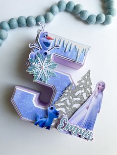 a frozen princess themed birthday card and necklace