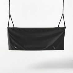 a black bag hanging from a rope