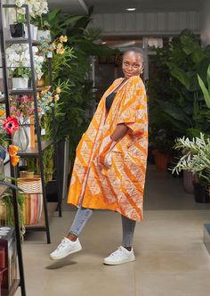 IT HAS POCKETS! A stunning blend of traditional African (tie & Dye) patterns and modern style. This versatile kimono is perfect for any occasion. Ideal for layering or as a statement piece... this one size fits ALL kimono adds elegance and culture to your wardrobe. Kimono as seen on model Oversized Cotton Kimono With Pockets, Summer Cotton Kimono With Pockets, Oversized Kimono With Pockets And Kimono Sleeves, Spring Orange Cotton Kimono, Spring Long Kimono With Pockets, Long Spring Kimono With Pockets, Orange Bohemian Cotton Kimono, African Print Kimono, Tie Dye Hat