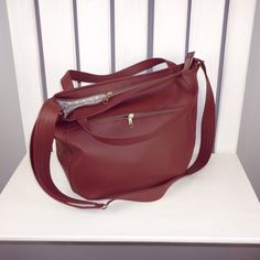 Made of vegan leather in beatiful shade of burgundy red, this large hobo tote for women can be your favorite daily use bag. Multifunctional - you can carry it in your hand, on the shoulder or as hippie crossbody purse. Universal - fits really well with any casual outfit. Large and roomy enough for all your stuff. Perfect for work, school, shopping and walk with children. It's durable, easy to pack and clean. Fastened with zipper. 100% handmade. DETAILS (shown): color: burgundy red pattern: 3in1 Burgundy Crossbody Hobo Bag For Everyday Use, Burgundy Crossbody Hobo Bag For Errands, Chic Burgundy Crossbody Hobo Bag, Burgundy Soft Leather Hobo Shoulder Bag, Burgundy Leather-lined Crossbody Shoulder Bag, Cross Shoulder Bags, Hobo Tote Bag, Red Crossbody, Hobo Crossbody Bag