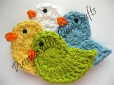 three crocheted birds sitting on top of each other