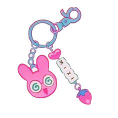 a pink key chain with an animal on it