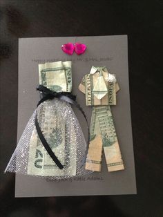 an origami doll made out of money