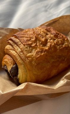 a pastry sitting on top of a piece of wax paper