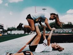 two women are playing baseball on the field