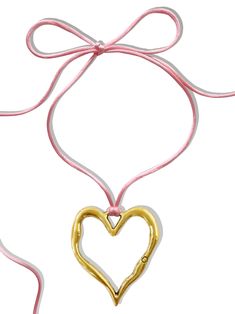 It's no surprise how this dreamy choker earned its name... You'll fall in love every time you look at it! Featuring the dreamiest pink satin cord and stunning statement-making heart pendant, the 'LOVE AT FIRST SIGHT' wrap choker is the necklace you've been waiting for. Trust us, compliments are waiting... Available in silver zinc alloy and 18K antique gold. Waterproof & rust-free. Made with genuine satin cord. 55" length - designed to allow you to tie this piece in multiple ways. Handmade with l Trendy Adjustable Choker For Valentine's Day, Adjustable Heart Pendant Choker For Valentine's Day, Trendy Pink Jewelry With Adjustable Cord, Valentine's Day Heart-shaped Adjustable Choker, Valentine's Day Pink Adjustable Necklace, Adjustable Heart Charm Choker Necklace, Pink Heart Choker As Gift, Pink Heart-shaped Choker As A Gift, Pink Heart-shaped Choker Gift