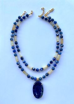 Sodalite and Sunstone Layered Necklace Set with Sodalite Pendant This elegant necklace set is a great gift for yourself and your loved ones. Made from natural Sodalite and Sunstone beads. All metal ornaments are 18K gold plated and won't get darker in time! This ensemble features two distinct necklaces, offering the versatility to adorn them individually or layer them for a stunning combined look. FREE SHIPPING ✈️✈️ - All orders get shipped within 1-2 business days. - 5-10 days of delivery time Returns are allowed 14 days after the delivery, however, the cost of delivery lies on the buyer. For more bracelets and necklaces!: https://finecrystalsdesign.etsy.com How to care for your necklace: * Avoid getting moisture, alcohol and perfume, if you do please dry the product with clean cloth. Ple Blue Beaded Necklaces With Gemstone Accents For Gift, Blue Lapis Lazuli Necklaces With Stones, Blue Lapis Lazuli Necklace With Stones, Blue Lapis Lazuli Stone Necklace, Blue Spiritual Necklace With Gemstone Accents, Blue Double Strand Spiritual Necklace, Spiritual Blue Gemstones With Accents, Eclipse Necklace, Layered Necklace Set