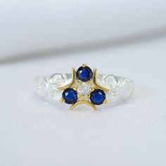 a white and blue ring sitting on top of a table