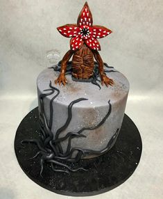 a cake decorated with an image of a turtle on it's head and legs