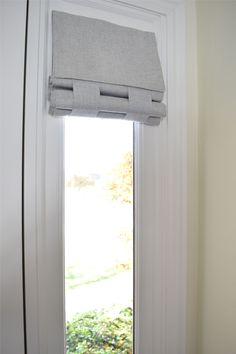 an open window with the blinds pulled back