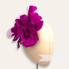 This extra large wired hat mount is EVERYTHING! Made up of two large blooms and four flower buds, this flower mount is entirely made from velvet with a touch of organza! Each petal has been carefully pressed to reveal a beautifully intricate pattern and has two stems of veined and wired leaves backing it.  Total mount length: 20cm (7.9 inches) For our full range of velvet hat flowers visit our Etsy shop here! www.etsy.com/shop/Petershams Orders are posted daily from Canterbury, England with expected delivery times of: Within the UK: 1-5 working days (by 1st Class Post) Outside the UK: 5-15 working days (by Standard Airmail) Upgraded traceable priority services are available for an extra cost at checkout. Handmade Flower Hat For Kentucky Derby, Floral Kentucky Derby Hats With Handmade Flowers, Kentucky Derby Flower Hat With Handmade Flowers, Kentucky Derby Hats With Handmade Flowers, Handmade Flower Fascinator For Garden Party, Handmade Flower Shape Fascinator For Garden Party, Flower-shaped Fascinator With Handmade Flowers For Garden Party, Kentucky Derby Flower Fascinator With Handmade Flowers, Garden Party Flower Hat With Handmade Flowers