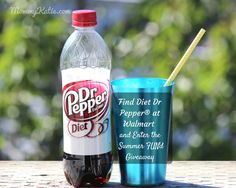 a bottle of dr pepper's and a blue cup with straws sitting on a table