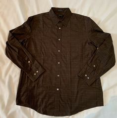 DKNY Men's Button Down Long Sleeve Brown with Green Stripe Shirt XL. Condition is Pre-owned. There are few tiny spots. See photo. First two pictures are an accurate depiction of color. Shoulders: 19.5” across Chest: 24” across Waist: 23.5” across Sleeve (from top of shoulder seam): 25.5” Length: 31.25” ￼ Shipped with USPS First Class Package. All sales final. Brown Button Up, Masc Clothes, Male Fits, Nice Accessories, Homecoming Ideas, Button Ups, Brown Long Sleeve, Brown Shirt, Brown And Green