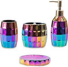 four pieces of colorful bathroom accessories including a soap dispenser and toothbrush holder