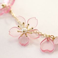 Have you been waiting for those gorgeous sakura blossoms to bloom? The wait is now over with our kawaii pink cherry blossom crystal bracelet! The perfect solution while you wait for mother Nature to get her groove on! Our ready-to-wear link chain bracelet is 15.5cm in length, with the extension chain being 7cm. Available in 3 different options, which of these lovely bracelets will you pick?! Get your kawaii pink cherry blossom crystal bracelet today! Pink Adjustable Chain Bracelet, Pink Jewelry With Adjustable Chain For Mother's Day, Mother's Day Pink Jewelry With Adjustable Chain, Pink Adjustable Chain Charm Bracelet, Pink Flower Charm Bracelet For Jewelry Making, Delicate Pink Bracelet With Flower Charm, Delicate Pink Round Bracelets, Pink Crystal Bracelet For Mother's Day, Pink Flower-shaped Bracelet Gift