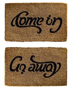 two door mats with the words come in and go out on them, one is black