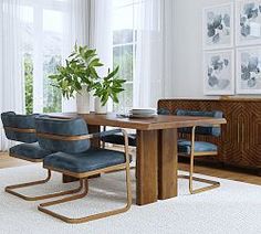 a dining room table with chairs and a plant