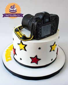 a cake with a camera and stars on it