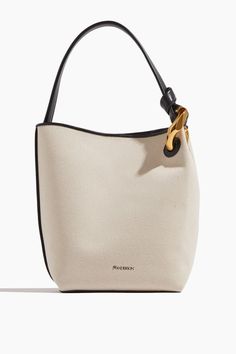 JW Anderson Shoulder Bags Corner Bucket Bag in Natural JW Anderson Corner Bucket Bag in Natural Luxury Canvas Bucket Bag With Detachable Handle, Everyday Bucket Bag With Gold-tone Hardware And Round Handle, Canvas Top Handle Shoulder Bag For Evening, Evening Canvas Shoulder Bag With Top Handle, Elegant Canvas Bag With Gold-tone Hardware, Evening Canvas Top Handle Shoulder Bag, Everyday Bucket Shoulder Bag With Chain Strap, Chic Canvas Hobo Bag, Modern Canvas Bag With Detachable Handle