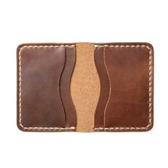 A Leather Wallet with unparalleled attention to detail.Upon holding this Natural colored wallet, you will immediately appreciate the craftsmanship. We take the time to hand-stitch every component of this wallet. We sand, burnish and polish the edges for an even, smooth feel. The soft, supple, leather feels lightweight yet durable at the same time. You won't be able to find this level of quality in a department store.Our full-grain leather means your wallet will develop character and patina. We h Handmade Brown Wallet For Everyday Carry, Brown Artisan Wallet With Coin Pocket, Artisan Brown Wallets With Coin Pocket, Rectangular Cognac Leather Trifold Wallet, Cognac Leather Rectangular Trifold Wallet, Cognac Leather Trifold Wallet, Hand-stitched Brown Leather Wallet, Artisan Brown Wallets With Interior Card Slots, Artisan Brown Wallet With Interior Card Slots