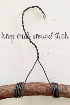 a piece of wire wrapped around a stick with the words wrap end around stick on it