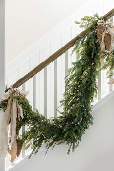 a christmas garland hanging from the banister