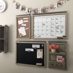 a bulletin board with magnets and pictures on it next to a wall mounted clock