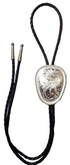 Shop Western Silver Engraved Bolo Tie with engraving on a 36-inch black braided leather cord. Get the best deal with 30 days return policy from Wild West Living. Black Adjustable Bolo Tie For Formal Occasions, Elegant Adjustable Concho Bolo Ties, Southwestern Silver Jewelry With Adjustable Cord, Western Style Black Bolo Tie With Adjustable Length, Black Western Bolo Tie With Adjustable Length, Western Black Bolo Tie With Adjustable Length, Southwestern Style Formal Bolo Tie, Adjustable Formal Bolo Tie With Concho, Western Style Silver Jewelry With Adjustable Cord