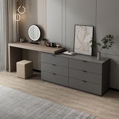 a room with a dresser, mirror and plant on the table in front of it