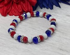 American Flag Colors Memory Wire Bracelet With Silver or Golden Charms - Etsy Patriotic Round Beads Stretch Bracelet For 4th Of July, Blue Adjustable Stretch Bracelet For 4th Of July, Patriotic White Stretch Bracelet With Round Beads, Patriotic White Stretch Bracelet, Patriotic Blue Beaded Stretch Bracelet, Adjustable White Bracelet For 4th Of July, Patriotic Blue Stretch Bracelet For 4th Of July, Patriotic Multicolor Stretch Bracelet For 4th Of July, Blue Beaded Patriotic Stretch Bracelet