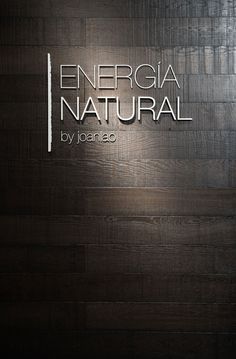 the logo for an energy natural by ionalio is displayed on a wood paneled wall