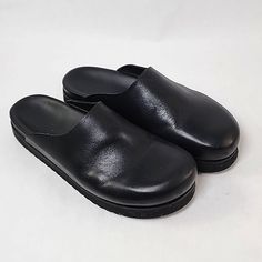 Black Leather Cos Slip-On Shoe Modern Black Clogs With Cushioned Footbed, Modern Black Mules With Cushioned Footbed, Black Clogs With Leather Footbed For Work, Classic Black Synthetic Clogs, Casual Black Mules With Leather Footbed, Modern Black Mules With Leather Footbed, Classic Black Mules With Rubber Sole, Casual Black Mules With Cushioned Footbed, Casual Black Flat Heel Mules