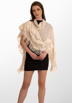 Indulge in the ultimate opulence with this ivory scarf woven from the finest cashmere. Wrap yourself in this statement piece elevated by its handcrafted tonal pearl-embroidered daisy flowers, exotic ivory lace panels and an ivory frill detailing on one side. This scarf brings with it a sense of timeless beauty, perfectly blending luxurious warmth and refined elegance. It is the ideal accessory to make heads turn on any formal evening out or a special occasion. Elegant Cream Embroidered Shawl, Luxury Cream Silk Scarf, Elegant Embroidered Wedding Scarf, Elegant Embroidered Silk Shawl Scarf, Elegant Embroidered Silk Shawl, Elegant Embroidered Pashmina Scarves, Cream Pashmina Scarves For Wedding, Beige Pashmina Scarf For Wedding, Wedding Cream Pashmina Shawl