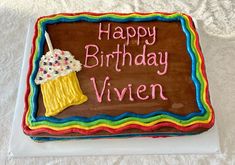 a birthday cake with a cupcake on it and the words happy birthday vivien written in frosting