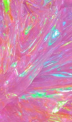 an abstract image of pink and green material with lots of iridescent colors on it