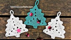 three crocheted christmas ornaments hanging on a wooden surface