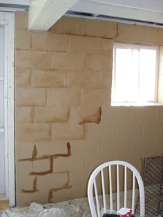 a room that is being remodeled with some paint on the walls and furniture in it