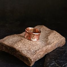 a ring sitting on top of a rock