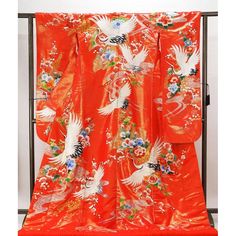 The red ground with lame foil is patterned with a fan-shaped seasonal flower pattern of cranes in blue, wisteria, coral pink, and other colors embroidered with gold and silver thread. The festive crane pattern on the shiny ground makes this gorgeous Uchikake suitable for a fine day. Length: 195.5 cm Length from sleeve to sleeve 66.5cm Sleeve length 105.5cm Front width 26.5cm Back width 31cm Material: Pure Silk Condition:Please see photos. ☆ This is a very gorgeous Uchikake. This is the highest rank of Japanese kimono, so it is recommended as a gift. The gorgeous patterns and embroidery can be used as a decoration for Japanese room interior ☆ Thank you for visiting my page. My store owns a lot of unique items that you won't see in other stores. You won't regret it! Please see photos for det Blue Wisteria, Crane Pattern, Flying Crane, Fan Flower, Japanese Room, Luxurious Wedding, The Four Seasons, Seasonal Flowers, Japanese Kimono