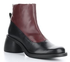 Crafted in durable leather, this two-tone boot bolsters your step with a comfy insole and a stable block heel. From Fly London. Calf Leather Boots With Contrasting Block Heel, Modern Leather Boots With Block Heel, Leather Boots With Contrasting Heel Counter And Square Toe, Leather Platform Boots With Rubber Block Heel, Leather Boots With Square Toe And Contrasting Heel, Leather Platform Boots With Square Toe, Modern Leather Boots With Contrasting Heel Counter, Modern Leather Boots With Contrasting Heel, Leather Workwear Boots With Contrasting Heel Counter